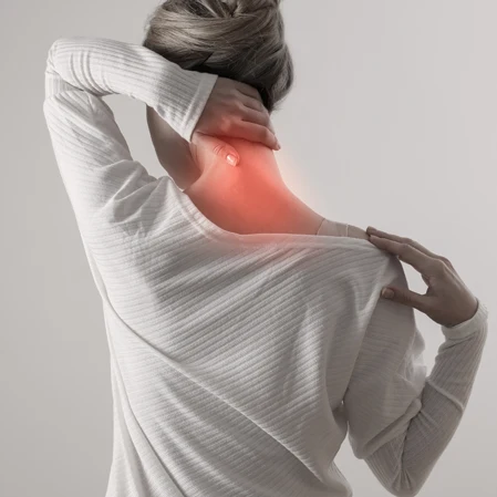 Person holding their neck in pain.